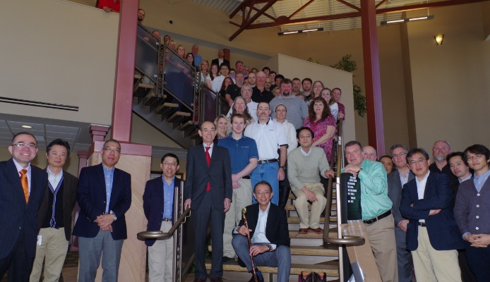 VIAM employees standing on a stairway